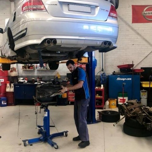 Mechanic Performing Vehicle Maintenance